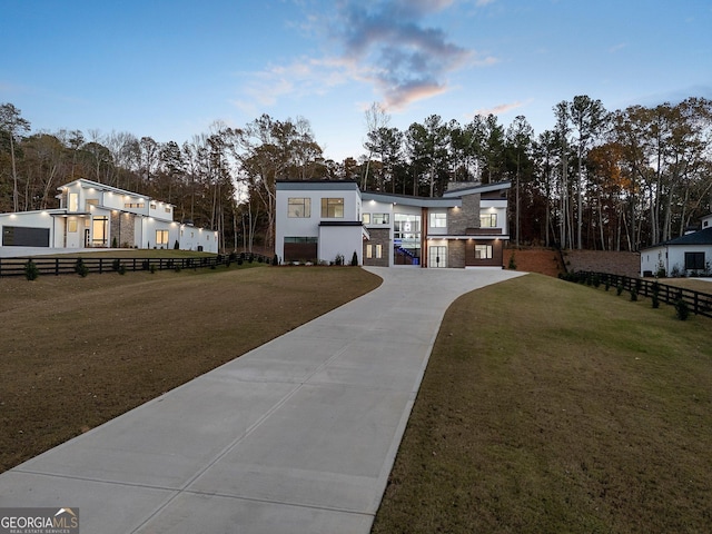 view of front of property with a lawn