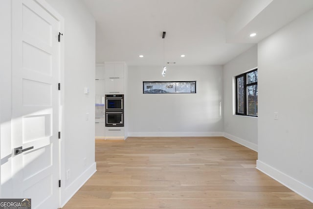 interior space with light hardwood / wood-style flooring