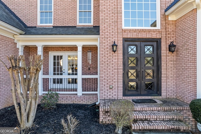 view of exterior entry featuring french doors