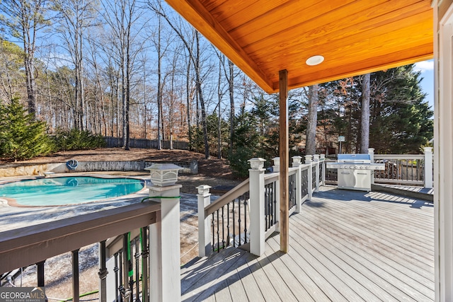 wooden deck featuring area for grilling