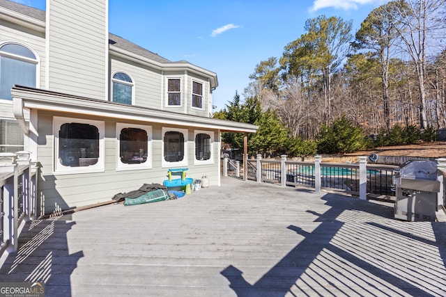 wooden terrace with area for grilling