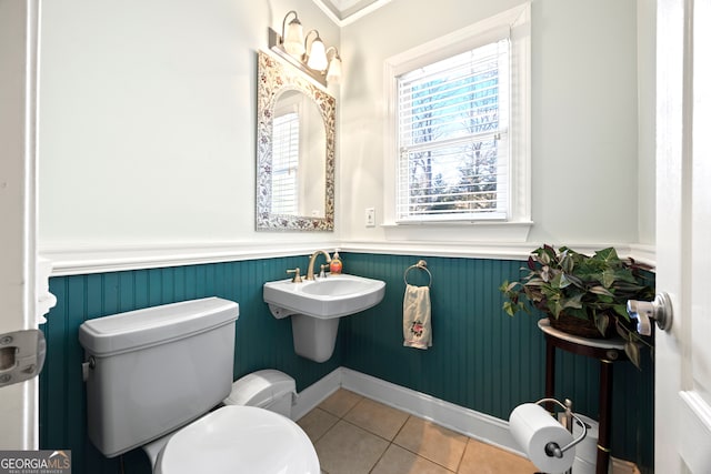 bathroom with tile patterned floors and toilet