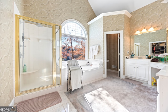 bathroom featuring vanity, shower with separate bathtub, tile patterned flooring, and vaulted ceiling