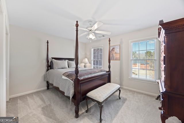 bedroom featuring light colored carpet and ceiling fan