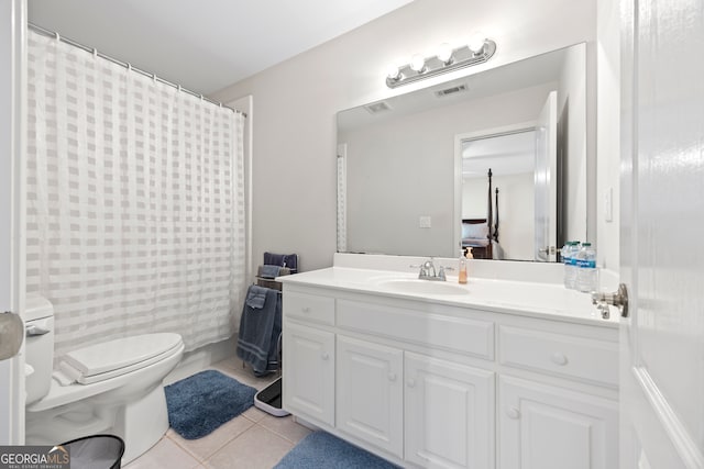 bathroom with walk in shower, tile patterned floors, toilet, and vanity