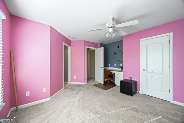 unfurnished bedroom featuring ceiling fan and carpet flooring