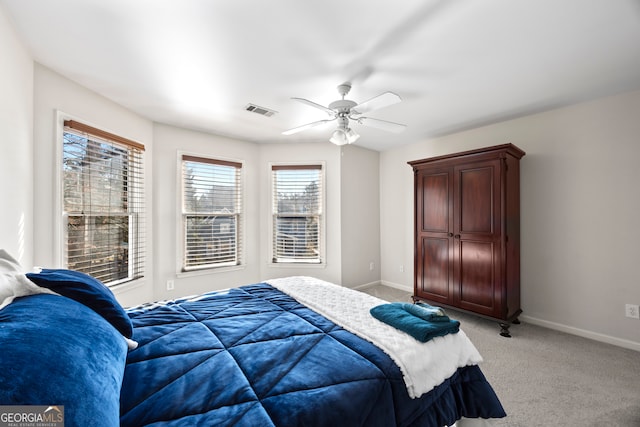 bedroom featuring light carpet and ceiling fan