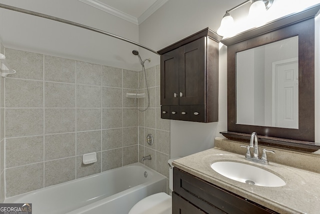 full bathroom with crown molding, toilet, vanity, and tiled shower / bath