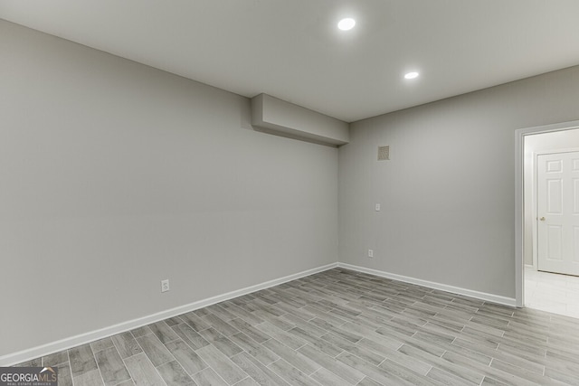 basement featuring light wood-type flooring