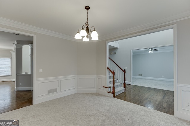 unfurnished room with crown molding, dark hardwood / wood-style flooring, and ceiling fan with notable chandelier