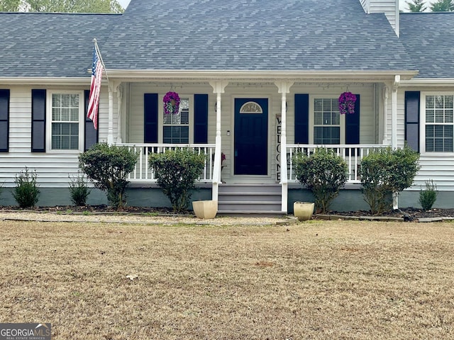 4320 Center Hill Church Rd, Loganville, GA 30052 - view of exterior entry featuring roof with shingles and a porch