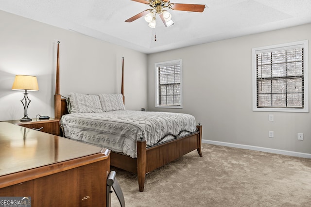 bedroom with light carpet and ceiling fan