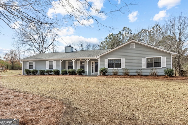 ranch-style home with a porch and a front yard