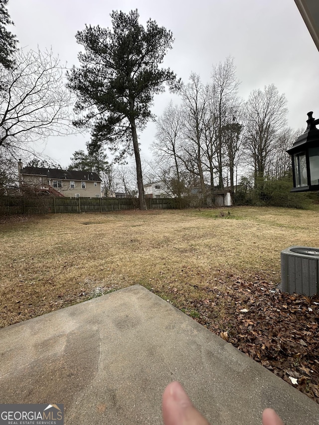 view of yard featuring cooling unit and a patio area