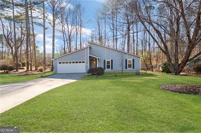 single story home featuring a garage and a front lawn