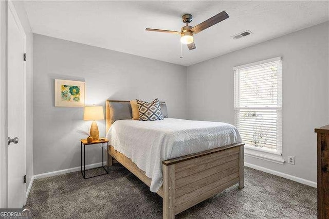 bedroom with dark carpet and ceiling fan