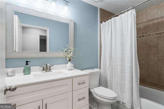 full bathroom featuring vanity, shower / bath combo, and toilet