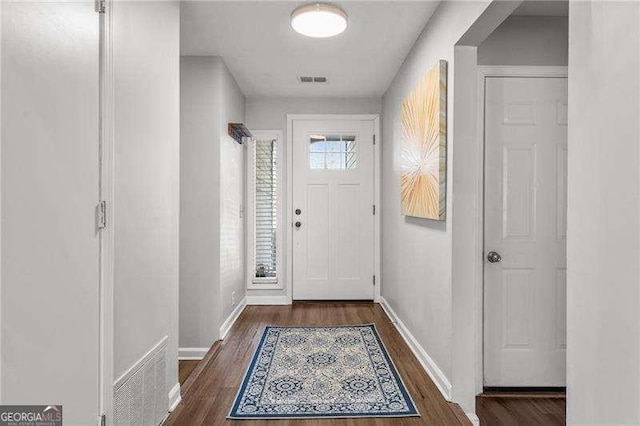 doorway to outside featuring dark hardwood / wood-style floors