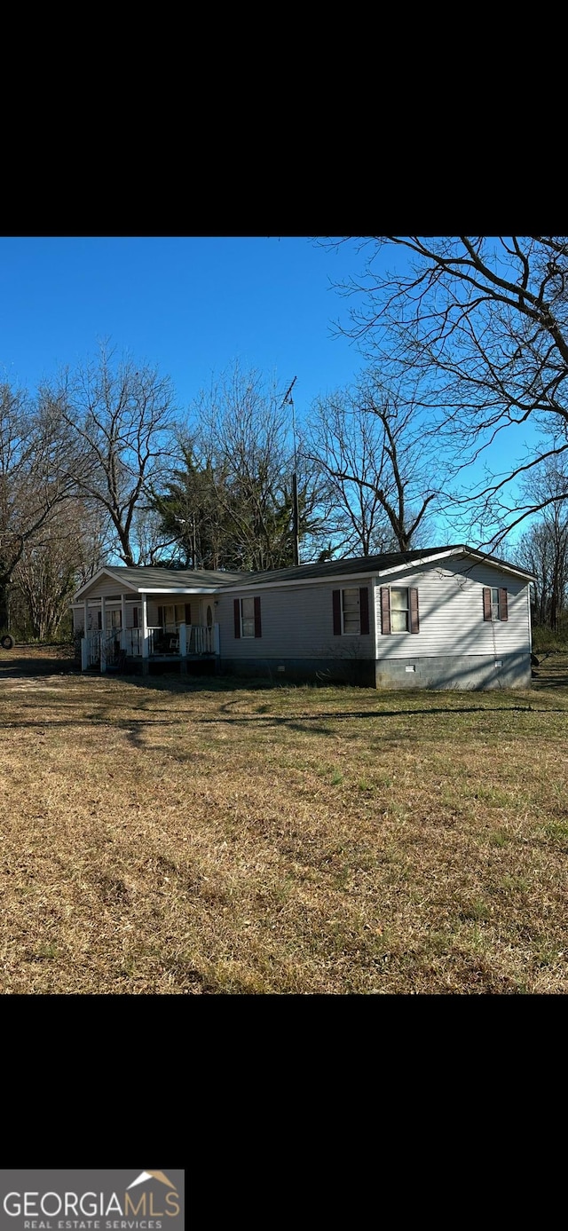 back of house with a yard