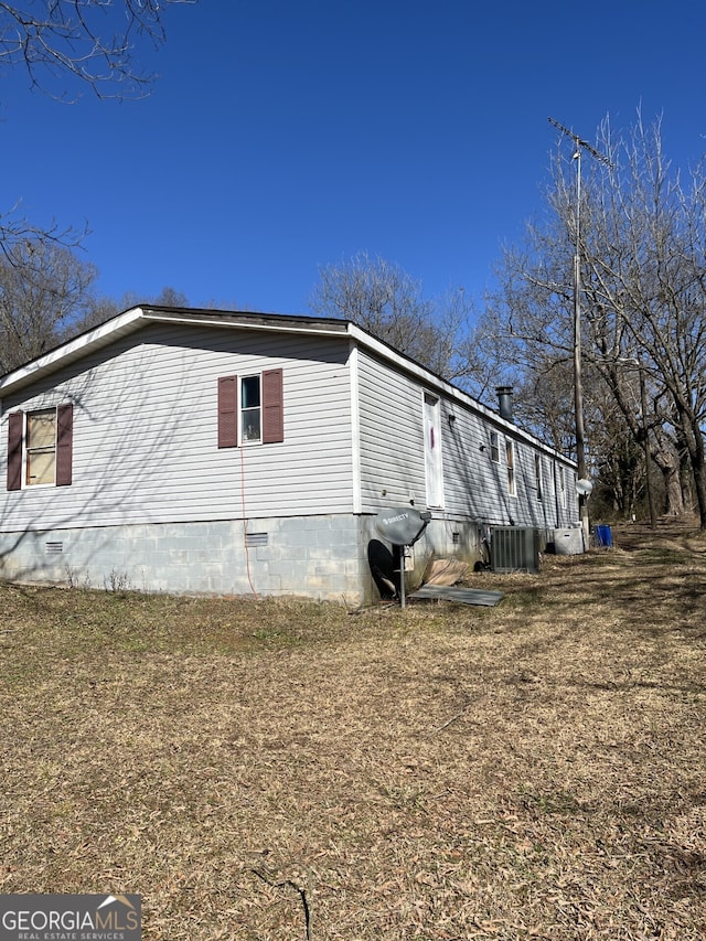 view of side of home featuring cooling unit