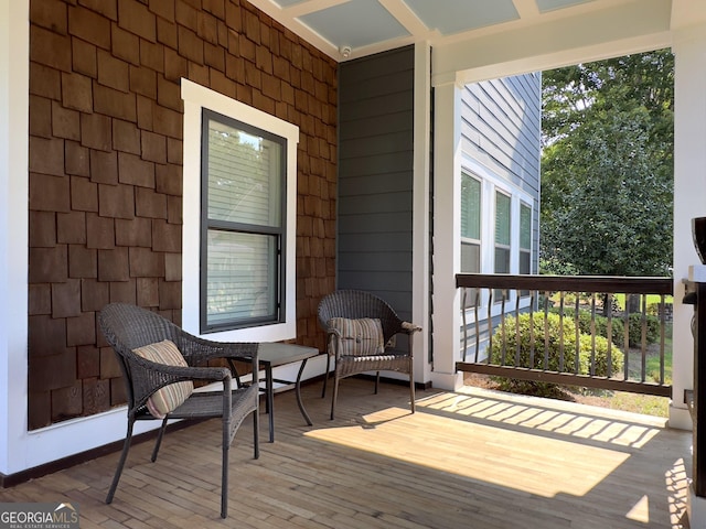 wooden terrace with covered porch