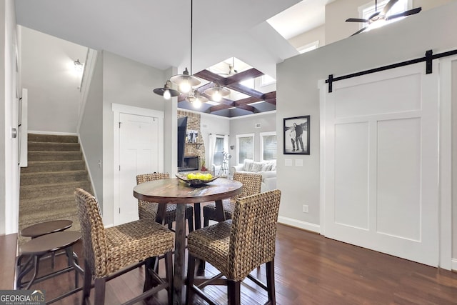 10 Plum Blossom Ln, Hampton, GA 30228 - dining area with a barn door, dark wood-style flooring, ceiling fan, baseboards, and stairway