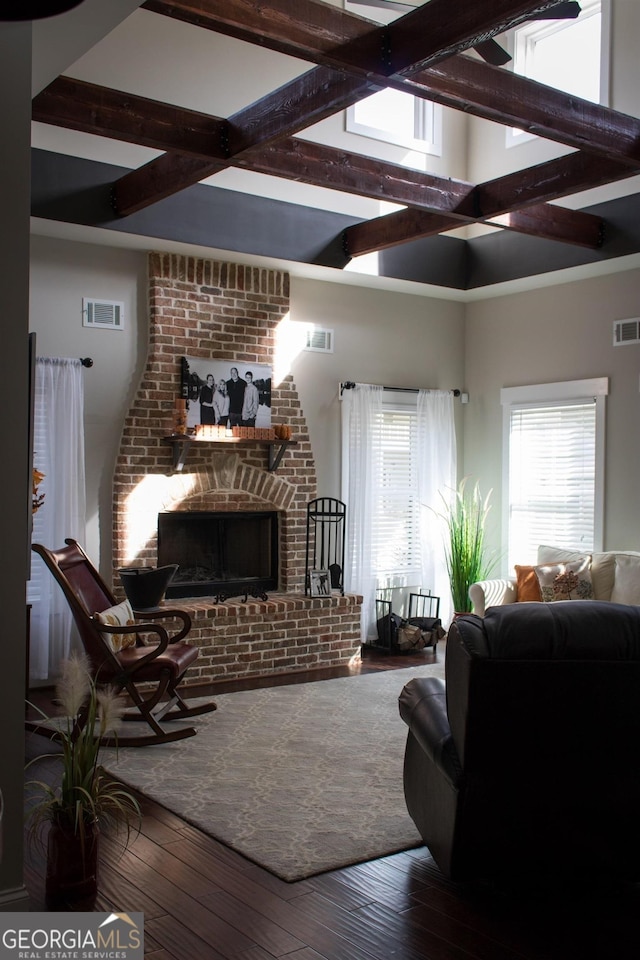 10 Plum Blossom Ln, Hampton, GA 30228 - living room featuring a brick fireplace, beam ceiling, and hardwood / wood-style floors