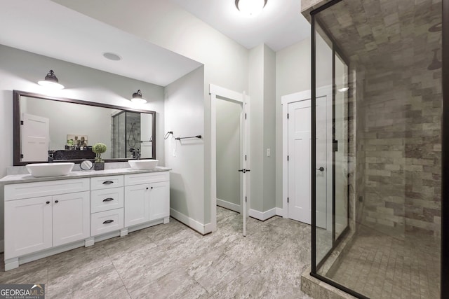 bathroom featuring vanity and a shower with door