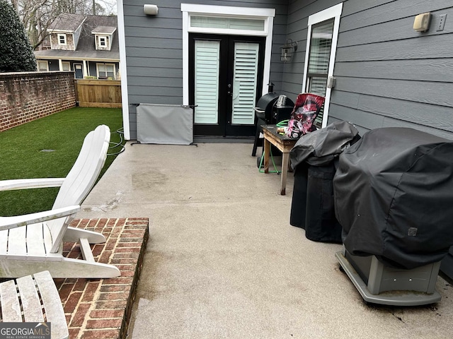 view of patio with a grill and french doors