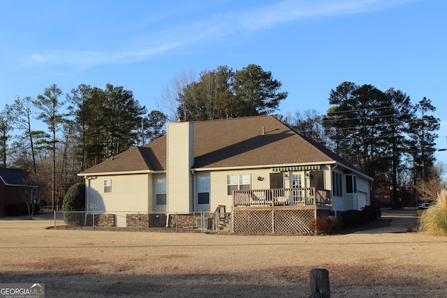 view of front of house featuring a wooden deck