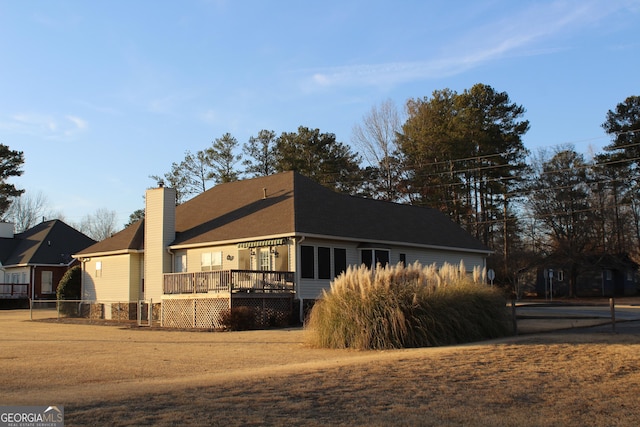 view of property exterior featuring a deck