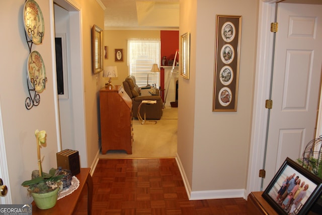 hall with dark parquet flooring