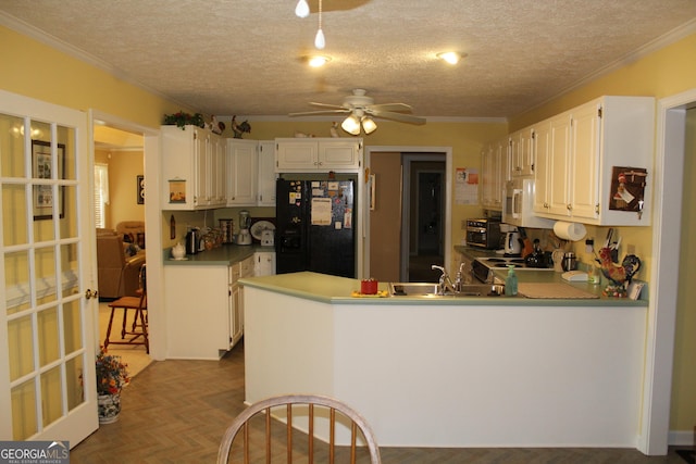 kitchen with white cabinetry, black fridge with ice dispenser, and kitchen peninsula