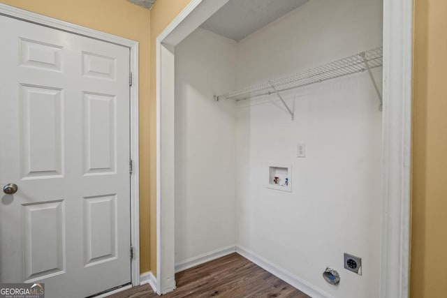 laundry room with dark hardwood / wood-style floors and hookup for an electric dryer