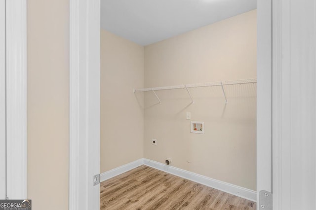 washroom with electric dryer hookup, washer hookup, and light hardwood / wood-style flooring