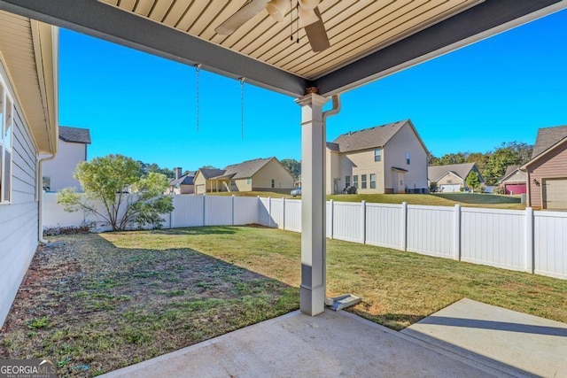 view of yard featuring ceiling fan and a patio area