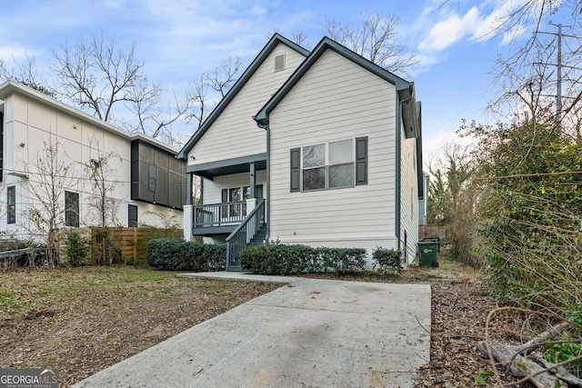 view of front of house with central AC unit and a porch