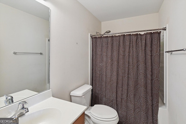 full bathroom featuring shower / bath combination with curtain, vanity, and toilet