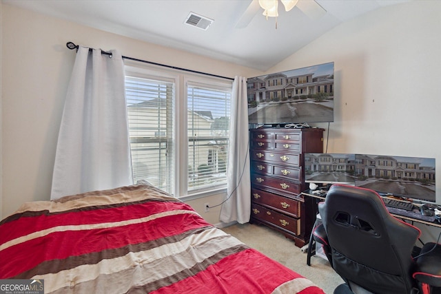 bedroom with ceiling fan, lofted ceiling, and light carpet