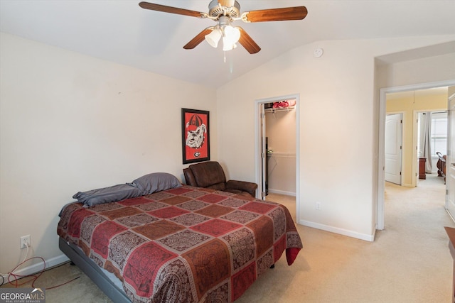 carpeted bedroom with lofted ceiling, a spacious closet, ceiling fan, and a closet