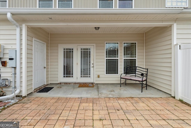 entrance to property with a patio area