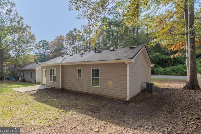 back of property featuring cooling unit and a patio area