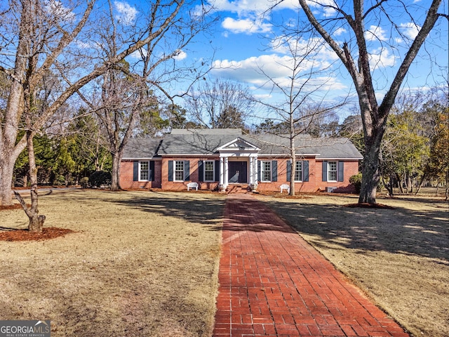 ranch-style home with a front lawn