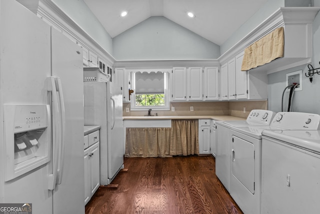 laundry area with separate washer and dryer, dark hardwood / wood-style floors, and sink