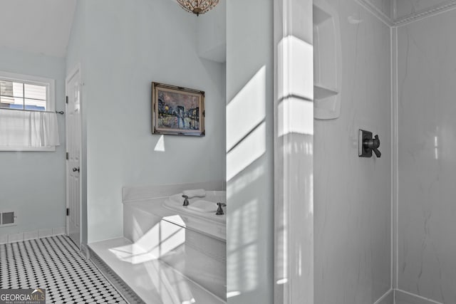 bathroom with tile patterned floors