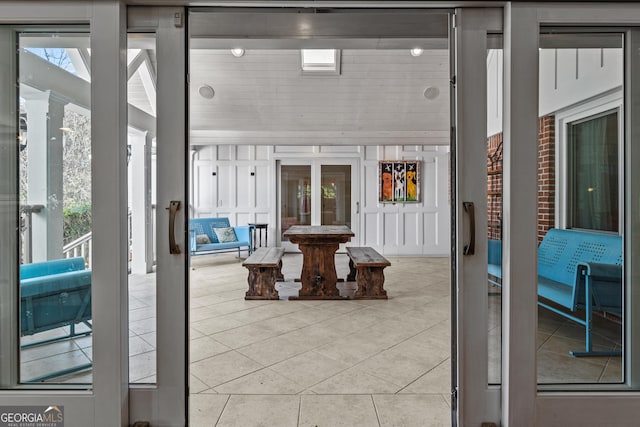 sunroom with a wealth of natural light and french doors