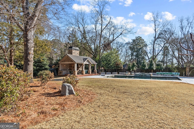 view of property's community featuring a patio, a swimming pool, an outdoor structure, and a lawn