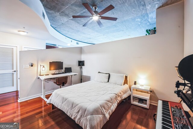 bedroom with wood-type flooring and ceiling fan