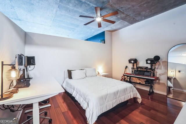 bedroom with dark wood-type flooring