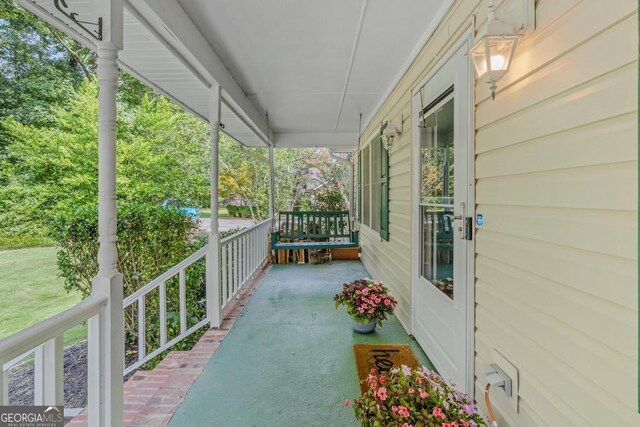 view of patio featuring a porch